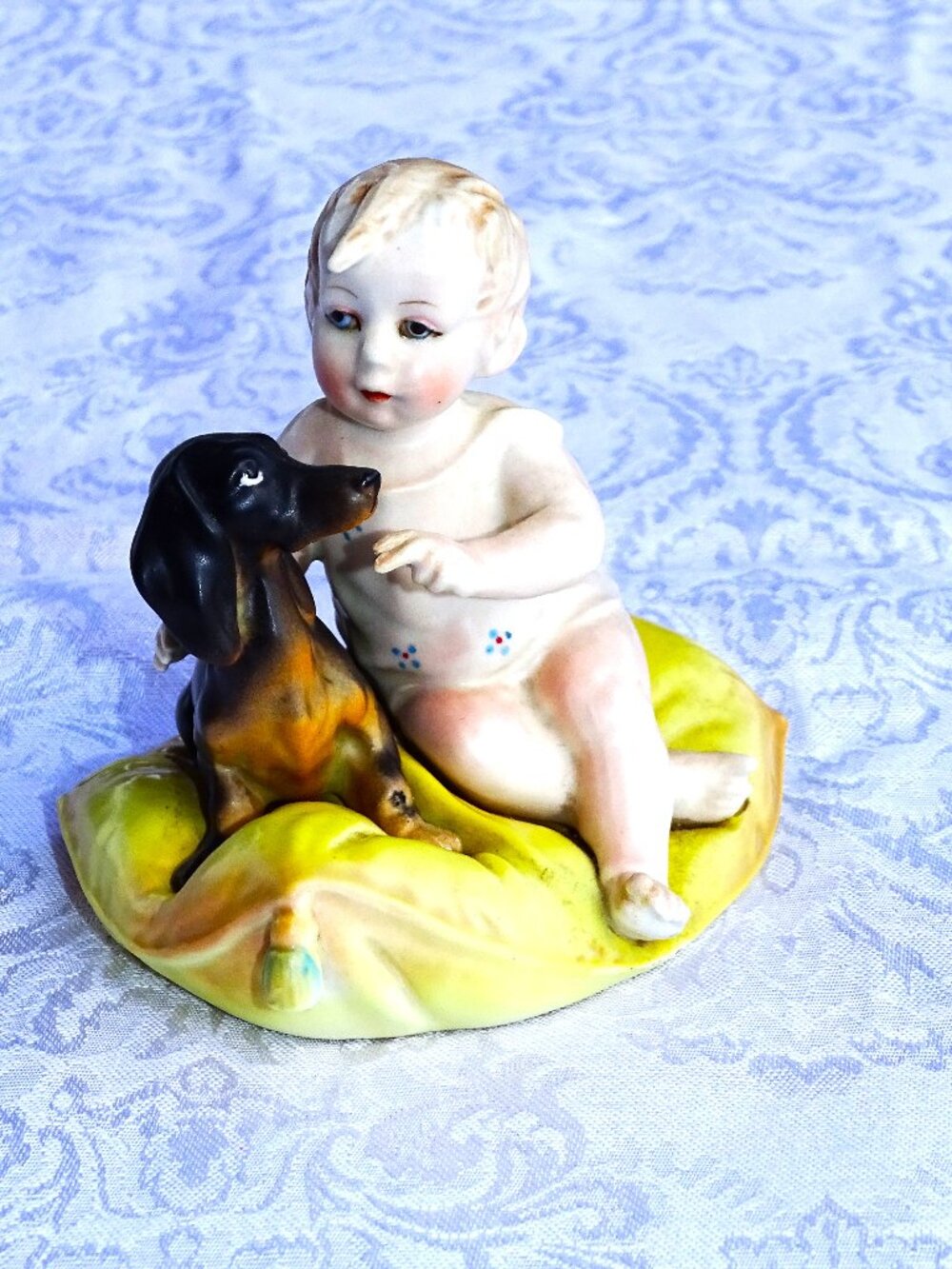 Child with Dachshund on a Yellow Pillow